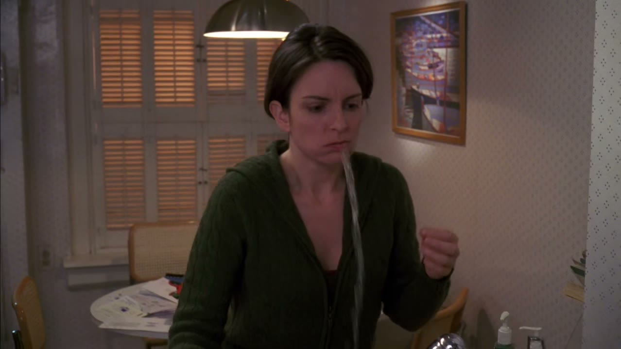 [TV playing in background]