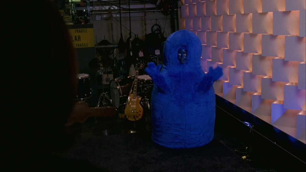 [Blue man making noises]