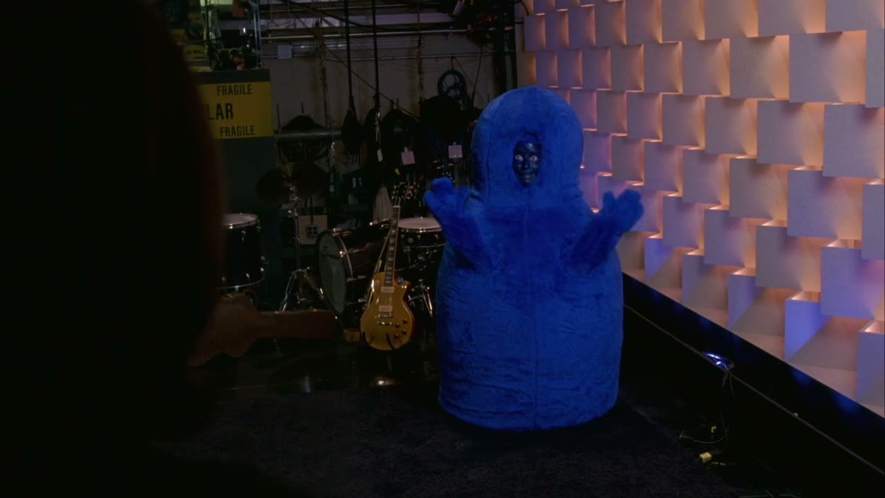 [Blue man making noises]