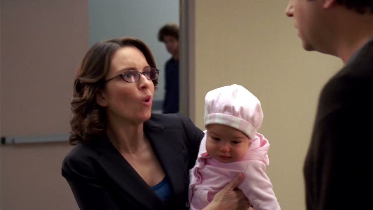 One minute, I was holding the baby in makeup.