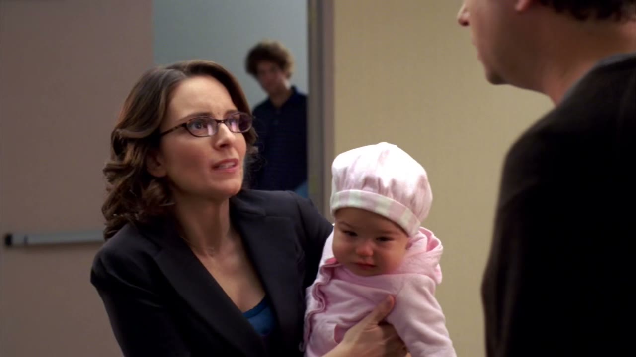 One minute, I was holding the baby in makeup.