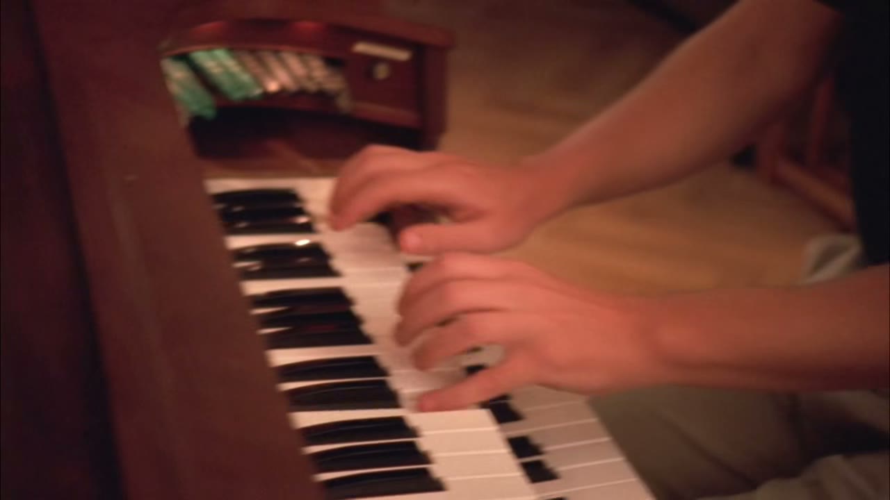 [Playing organ]