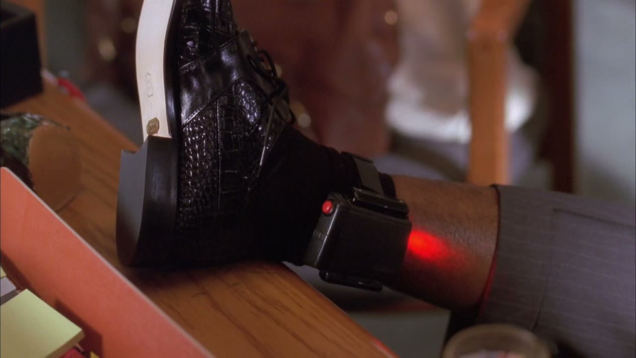 A signal goes to ankle bracelet headquarters