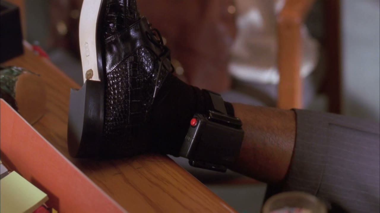 A signal goes to ankle bracelet headquarters