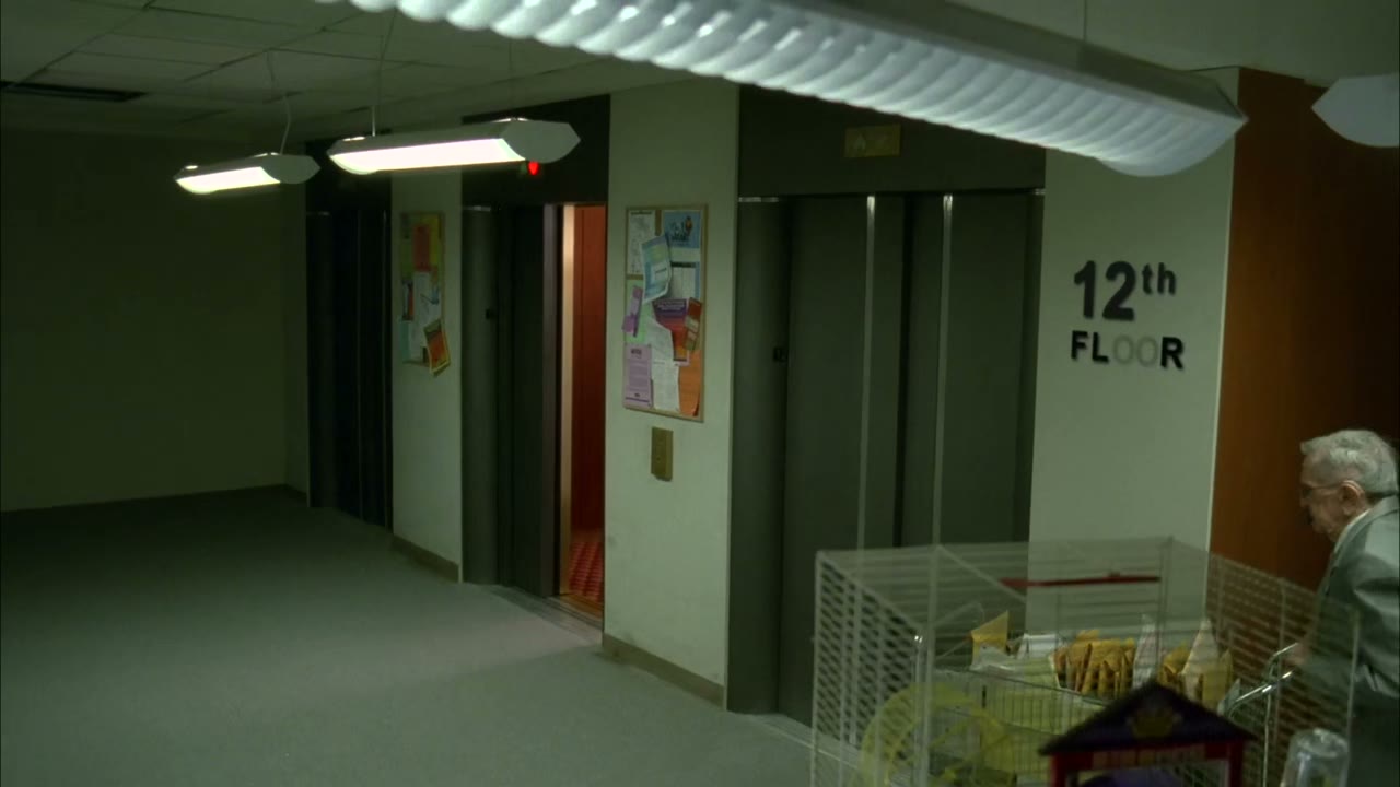 [Elevator bell dings]