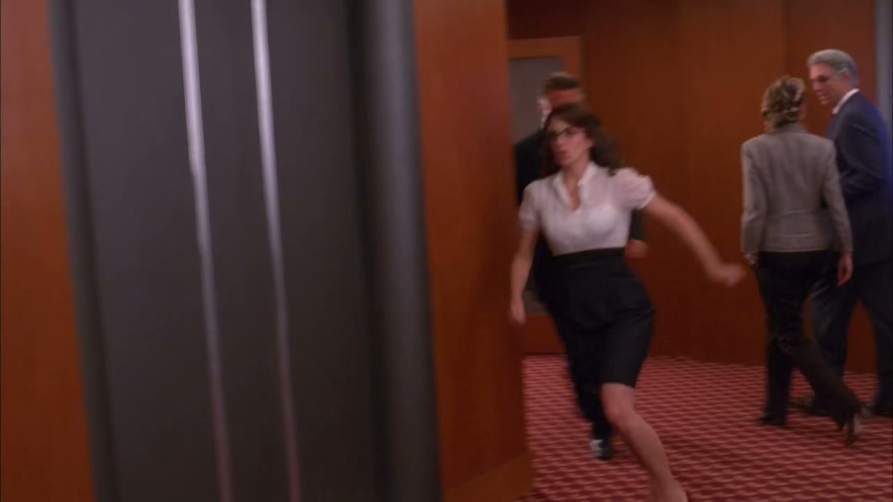 [Elevator dings]