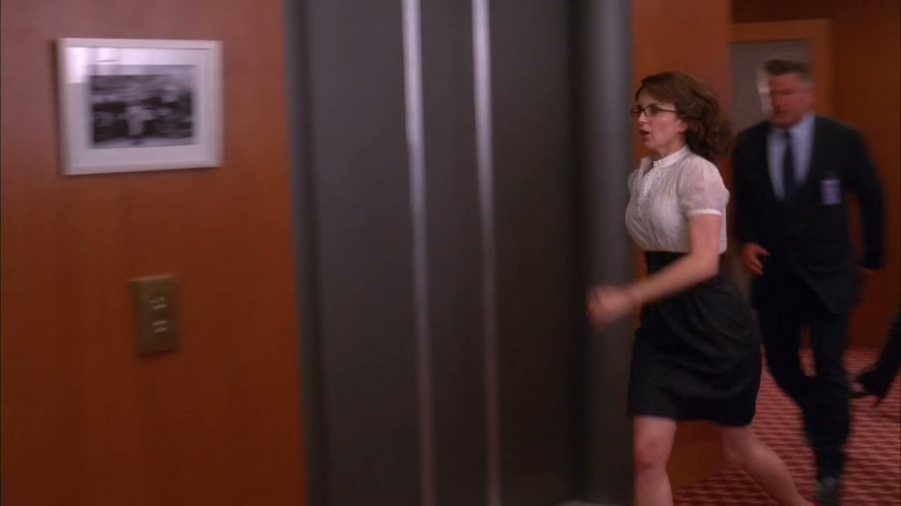[Elevator dings]