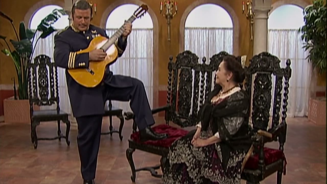 [Spanish guitar music]