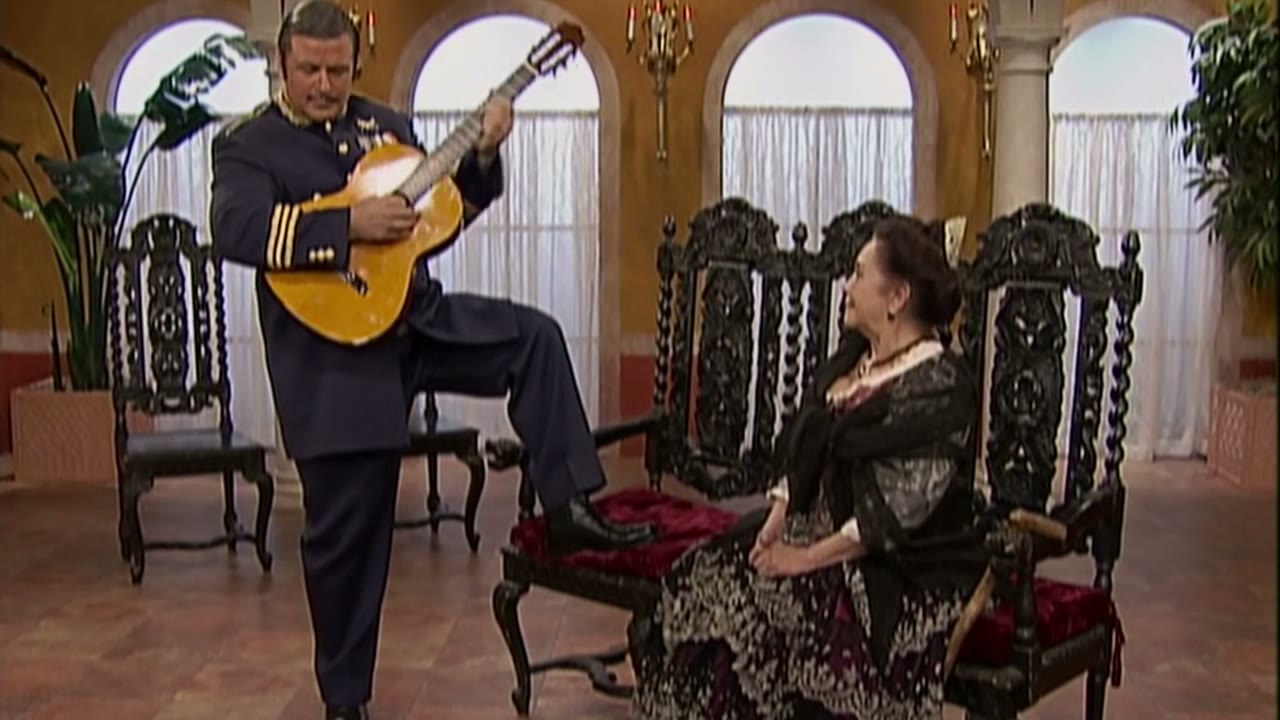 [Spanish guitar music]