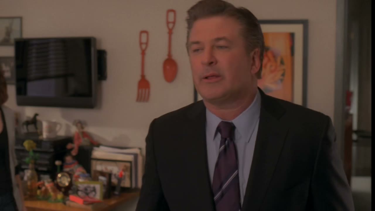 His pen or his tie clip.