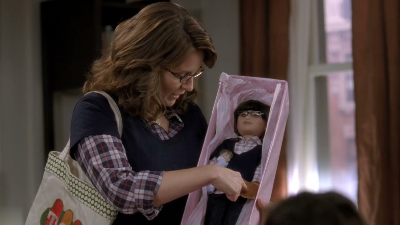 And he/she has his/her baseball glove and baby.