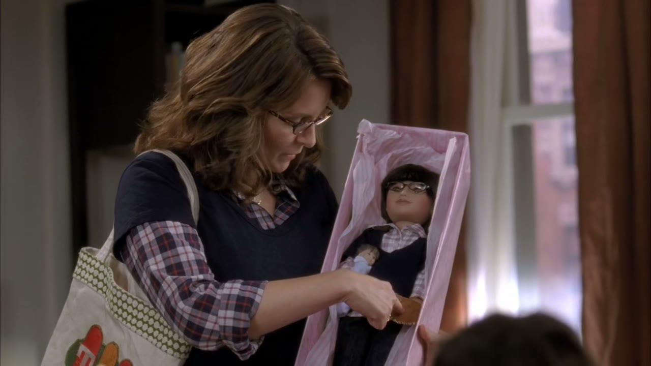 And he/she has his/her baseball glove and baby.
