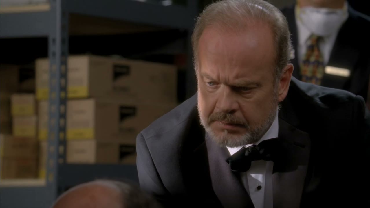 He's pressed an elevator button.