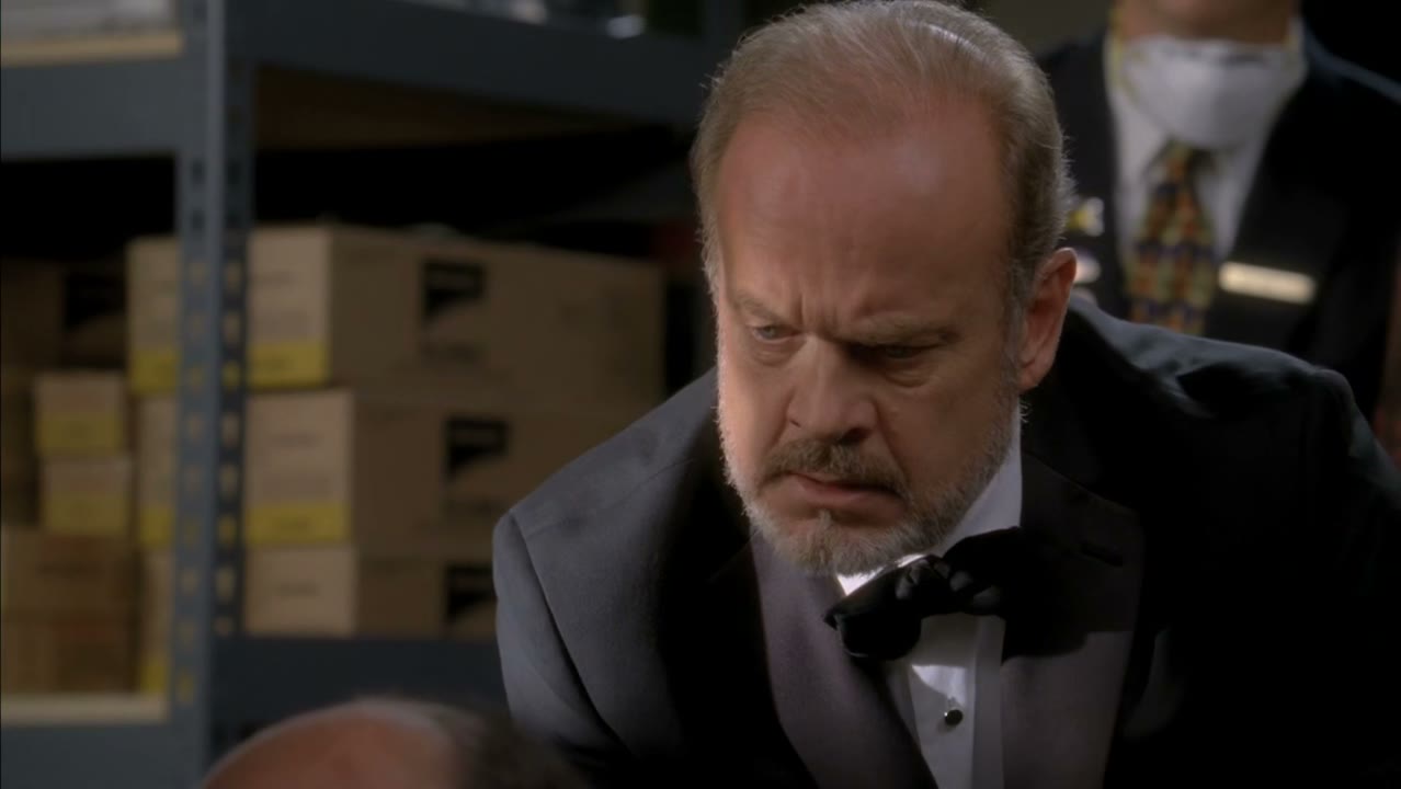 He's pressed an elevator button.