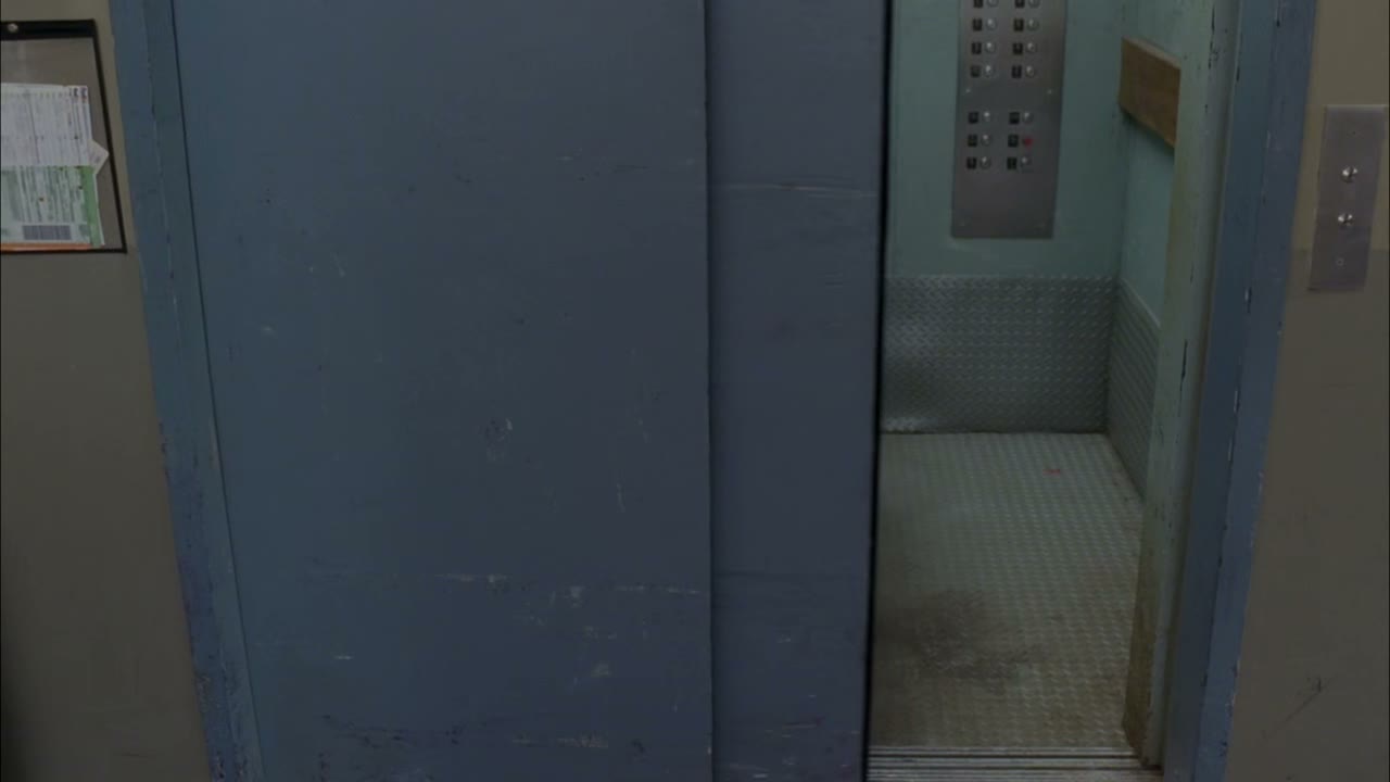 [Elevator dings]